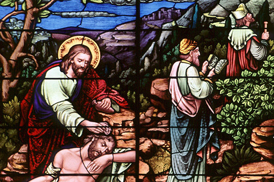 A stained glass window at Sacred Heart Church in Freeport, Minn., depicts the good Samaritan. The 2,000-year-old parable of the Good Samaritan is the anchor of the encyclical “Fratelli Tutti, on Fraternity and Social Friendship.”